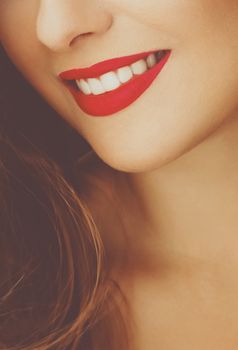 Happy healthy female smile with perfect natural white teeth, beauty face closeup of smiling young woman, bright lipstick makeup and clean skin for dental and healthcare brands