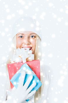 Merry Christmas and glitter snow background, happy blonde girl with gift boxes in winter season for shopping sale and holiday brands