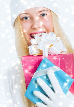 Christmas and glitter snow background, happy blonde girl with gift boxes in winter season for shopping sale and holiday brands