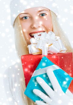 Happy Christmas and glitter snow background, happy blonde girl with gift boxes in winter season for shopping sale and holiday brands