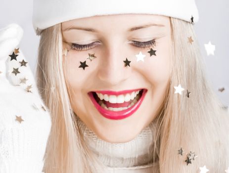 Cheerful blonde girl in Christmas time, woman with positive emotion in winter season for shopping sale and holiday brands