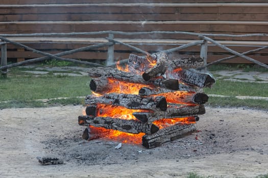 Fire. The burned wood formed coals and a strong heat. Stock photo.

