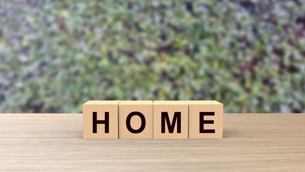 Home word Wooden cubes on table horizontal over blur background with climbing green leaves, mock up, template, banner with copy space for text, find house, rent apartment, happy family