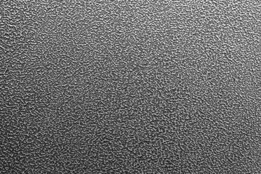 Texture and full frame background of hammered powder paint coating on flat sheet steel surface. Also known as hammertone effect.
