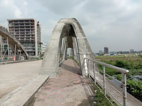 stylish steel and concrete bridge on lake