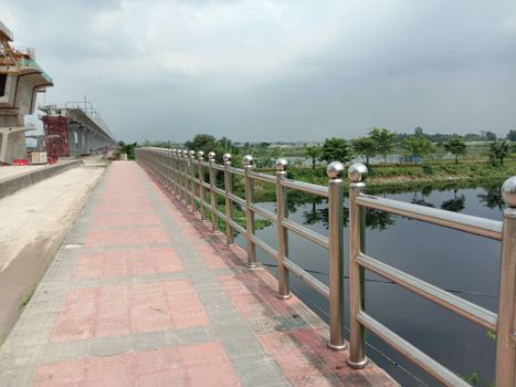 stylish steel and concrete bridge on lake