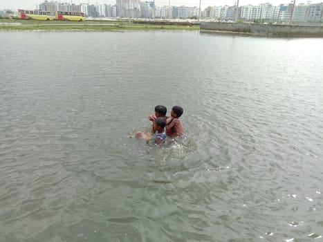 Childs swimming on lake with happiness