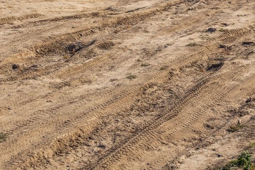 dusty dry dirt road under direct sun light - full frame close-up shot