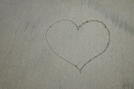 Heart drawn on sand. Horizontal composition. Heart drawn on perfectly white sand of paradise beach.