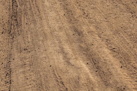 dusty dry dirt road under direct sun light - full frame close-up shot