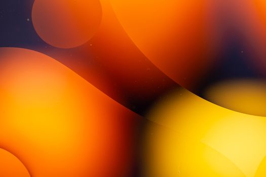 a Close-up water and oil abstract in a rainbow lighting effect
