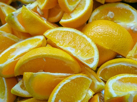 The close up of sliced fresh sweet orange fruit background.