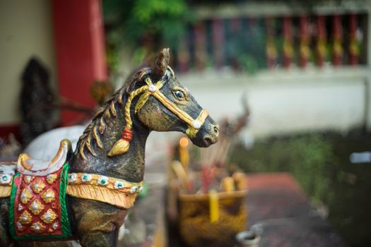 closeup of the head of horse statue at the shrine