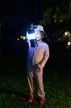 portrait of Little girl with lightning at the night