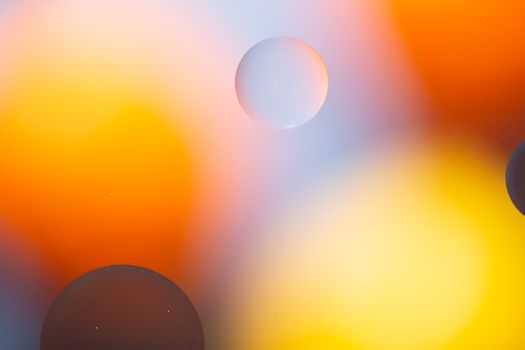 a Close-up water and oil abstract in a rainbow lighting effect