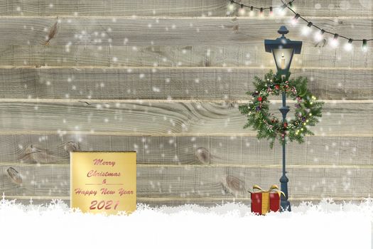 Christmas 2021 New Year wooden background Xmas gift boxes, floral wreath, string of lights, street light on wooden background with snow. Text Merry Christmas Happy 2021 New Year. 3D Illustration.