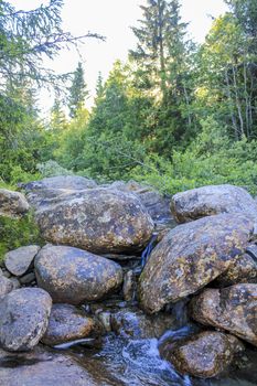 Big rocks and river of the waterfall Rjukandefossen in Hemsedal, Viken, Norway.