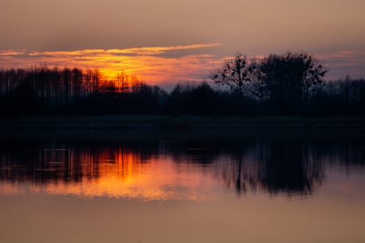 Beautiful sunset on Lake Stankow in Poland, spring evening view