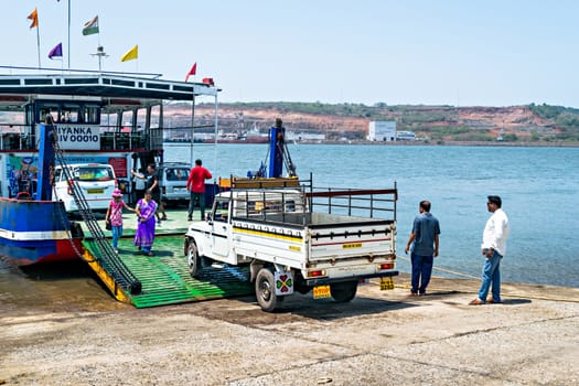 Jaigad,Maharashtra,India-May 2nd,2016:Vehicles being loaded in ferry boat at Jaygad to cross the creek.