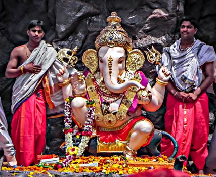 Pune,Maharashtra,India-September 22nd,2010:Decorated and garlanded huge idol of Hindu God Ganesha during festival procession.