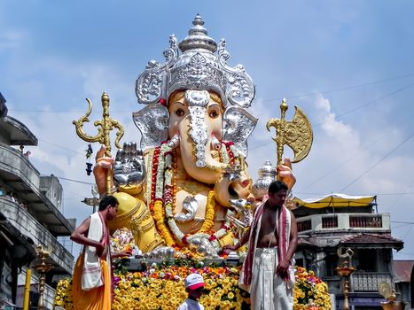 Pune,Maharashtra,India-September 22nd,2010:Decorated and garlanded huge idol of Hindu God Ganesha during festival procession.