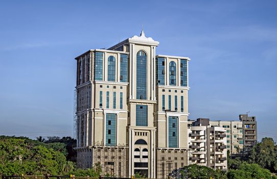 Pune,Maharashtra,India-October 7th,2016: An upcoming commercial building with blue sky background.