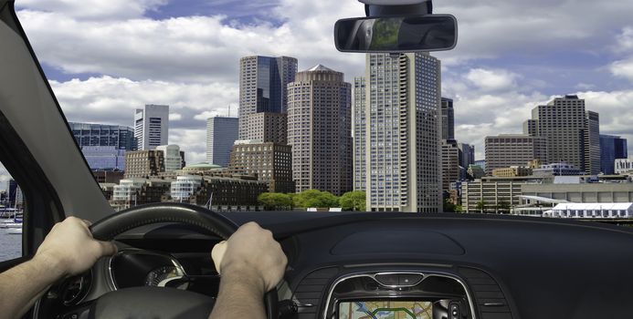 Driving a car towards the scenic skyline of Boston, Massachusetts, USA