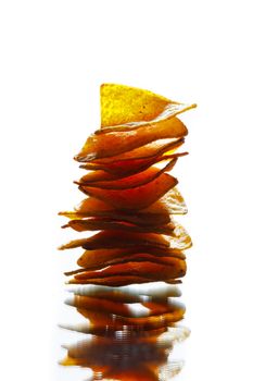 mexican nachos tortilla chips stack, isolated on white