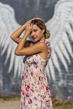 A gorgeous blonde model enjoys a summers day outdoors in a small town