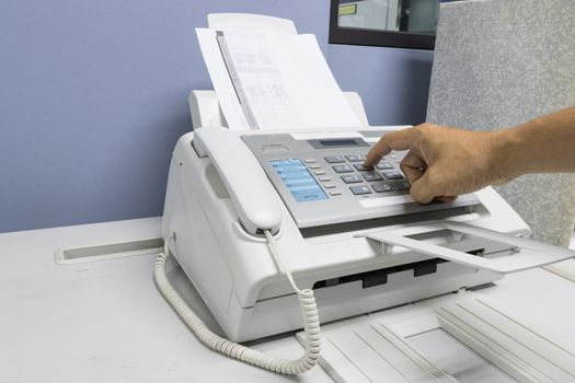 The fax machine use for Sending documents in the office, concept equipment needed in office 