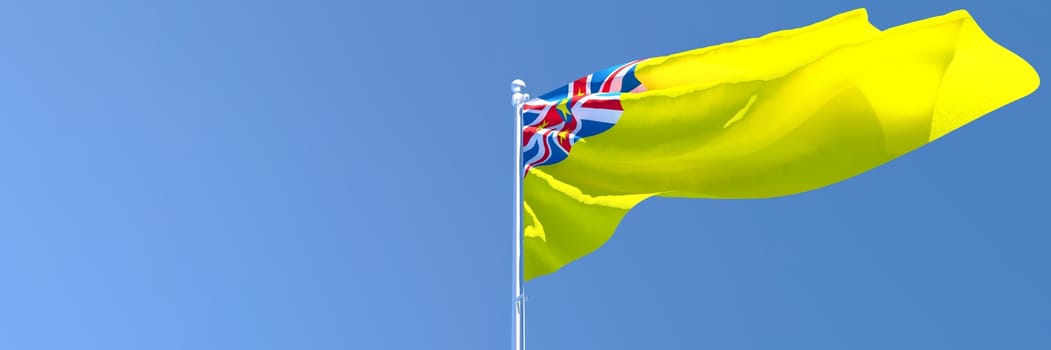 The national flag of Niue flutters in the wind.