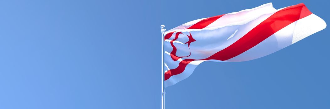 3D rendering of the national flag of Northern Cyprus waving in the wind against a blue sky