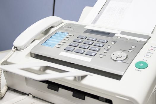 The fax machine use for Sending documents in the office, concept equipment needed in office 