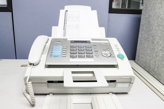 The fax machine use for Sending documents in the office, concept equipment needed in office 