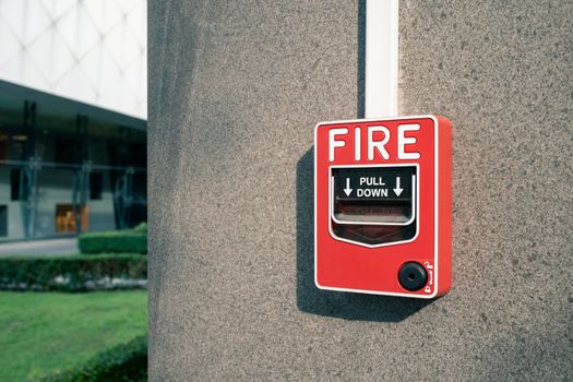 fire alarm system on wall at open air shopping plaza, shallow depth of field