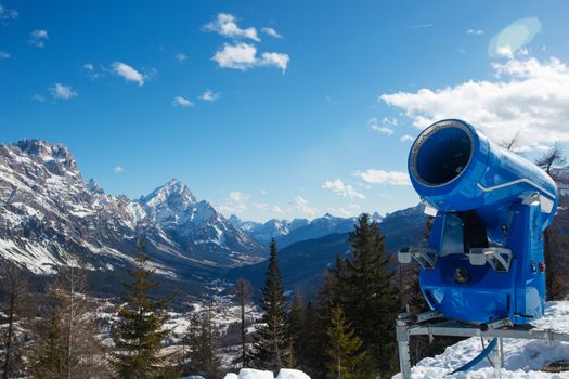 Snow Gun cannon at Italy mountains, Dolomites Dolomiti in wintertime beautiful alps winter mountains landscape , view from Toffana ski slope Cortina d'Ampezzo mountain peaks famous landscape skiing resort area