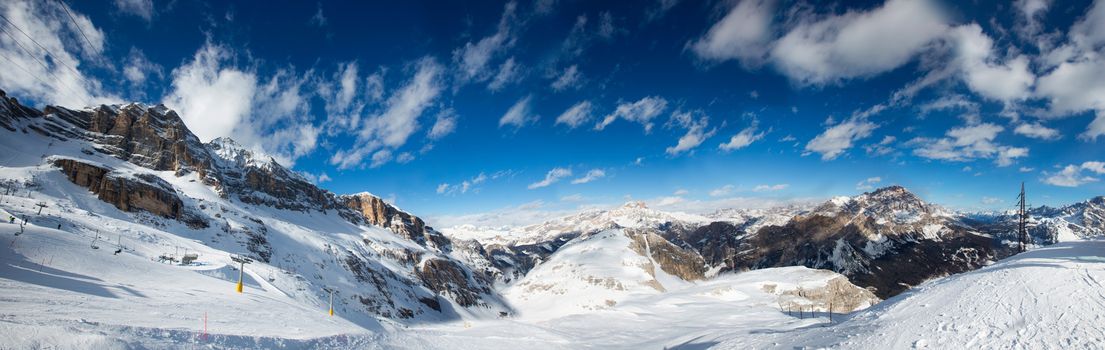 Dolomites Dolomiti Italy in wintertime beautiful alps winter mountains landscape , view from Toffana ski slope Cortina d'Ampezzo mountain peaks famous landscape skiing resort area