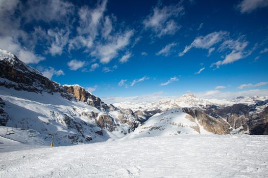 Dolomites Dolomiti Italy in wintertime beautiful alps winter mountains landscape , view from Toffana ski slope Cortina d'Ampezzo mountain peaks famous landscape skiing resort area