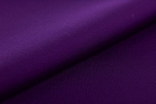 purple Knitted elastic fabric, weaving of threads texture, crumpled fold. For underwear, sports clothes and swimwear. Space for text.