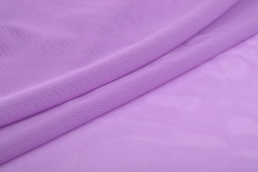 purple Knitted elastic fabric, weaving of threads texture, crumpled fold. For underwear, sports clothes and swimwear. Space for text.