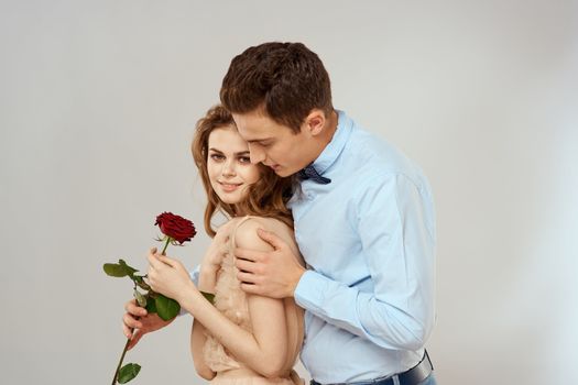 Man and woman with red rose romance love family couple holiday. High quality photo