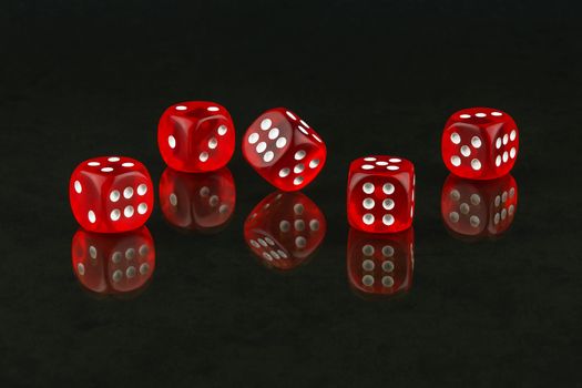 On the glass surface are recognized and red dice poker