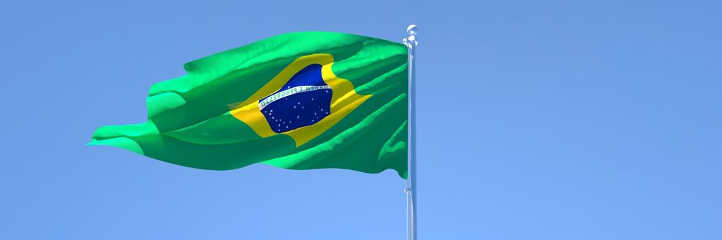 3D rendering of the national flag of Brazil waving in the wind against a blue sky