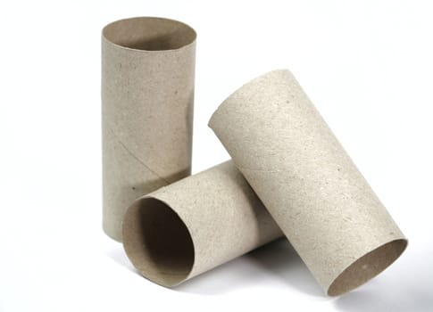 Three Empty toilet paper roll on white background