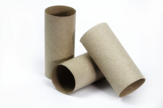 Three Empty toilet paper roll on white background