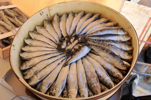 Salted fish products for sale at a market stall in Spain