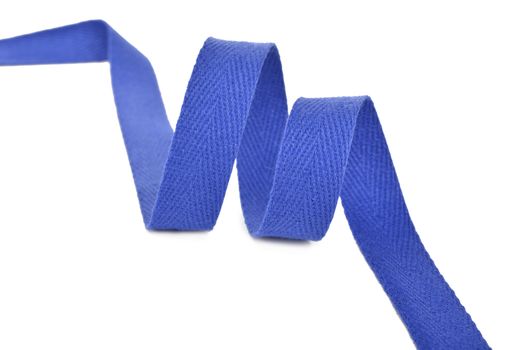 blue Twisted ribbon of cotton Keeper braid on white background. Tape For sewing clothes.