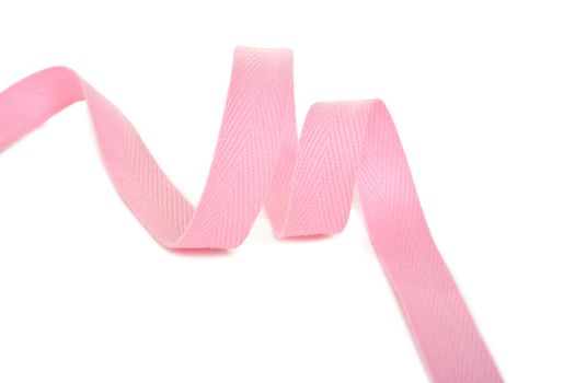 pink Twisted ribbon of cotton Keeper braid on white background. Tape For sewing clothes.