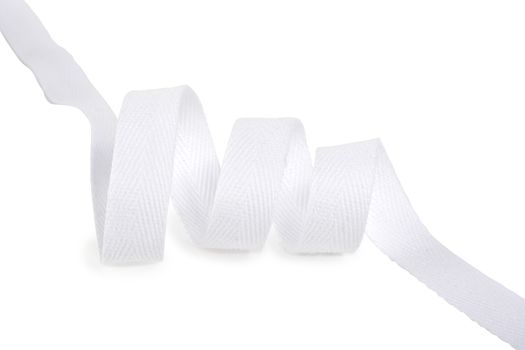 white Twisted ribbon of cotton Keeper braid on white background. Tape For sewing clothes.