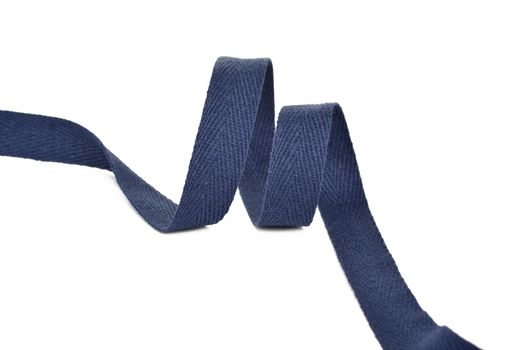 blue Twisted ribbon of cotton Keeper braid on white background. Tape For sewing clothes.